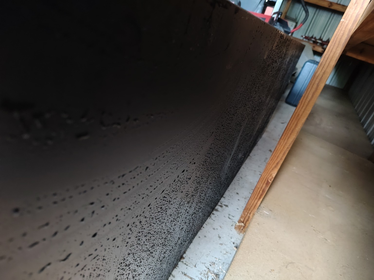 Close-up of water droplets on powder-coated steel planter box