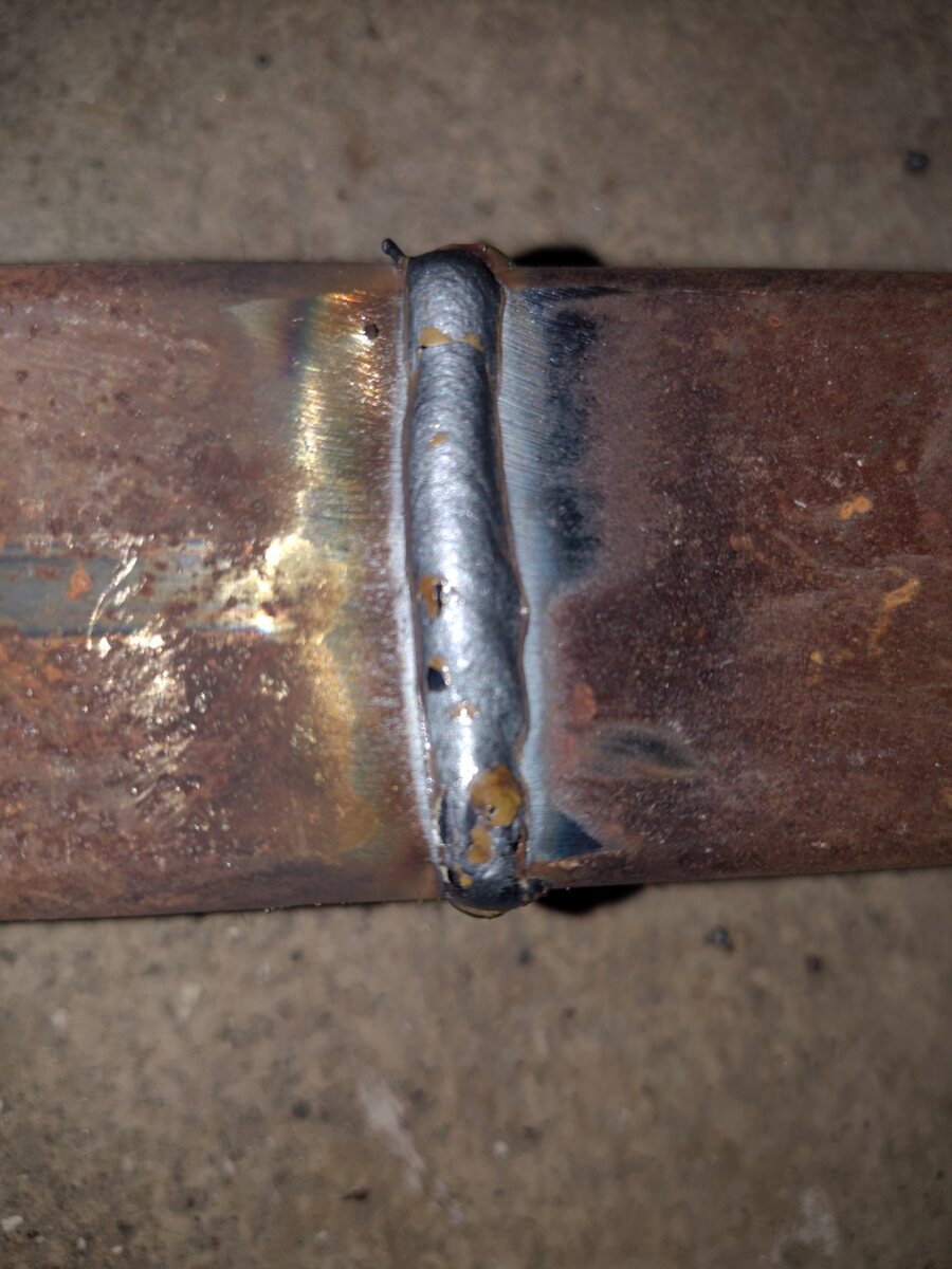 Close-up of welded steel pipe repair